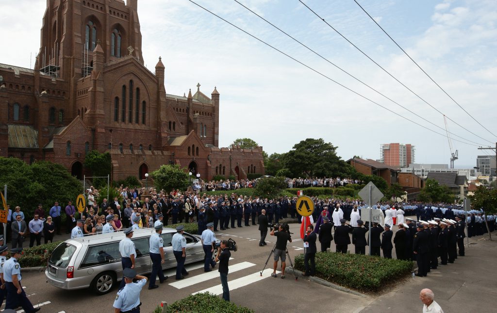 SOLEMN OCCASION : A large crowd farewells NSW police sergeant Geoffrey Richardson in Newcastle. SOLEMN OCCASION : A large crowd farewells NSW police sergeant Geoffrey Richardson in Newcastle.